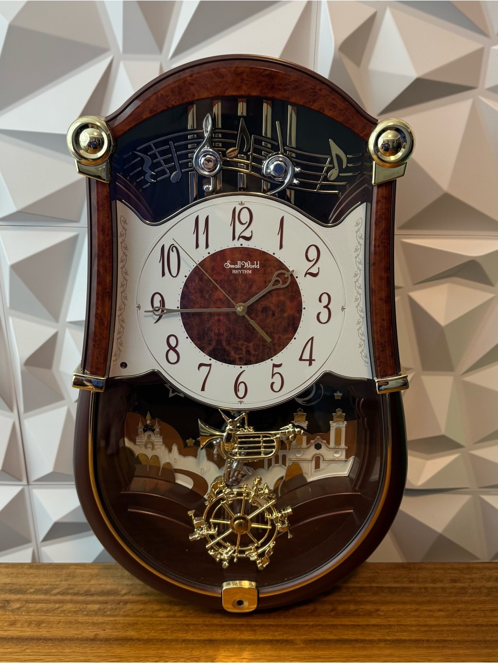 Rhythm Small World Musical Wall Clock (Trumpet & Winter Scene)